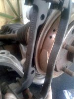 caliperbrackethittingbackingplate.jpg