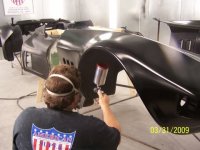 #43.084- March 31, 2009- Phil Somers painting the base black onto the panels.JPG