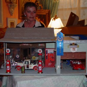 Dollmaker and her handiwork.