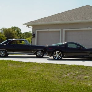 Vette outside in front of garage with brother