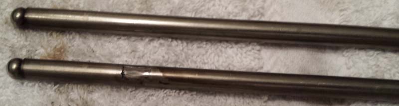 pushrod worn from hitting head