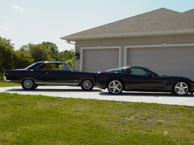 Vette outside in front of garage with brother